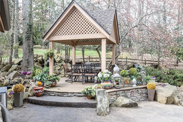 view of patio featuring a gazebo and outdoor dining space