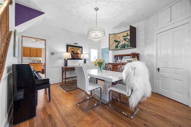 1556 W Ingomar Rd, Franklin Park, PA 15237 - dining space featuring light wood-style floors, a chandelier, a ceiling fan, and baseboards