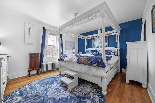 1556 W Ingomar Rd, Franklin Park, PA 15237 - bedroom with radiator heating unit, wood finished floors, and baseboards