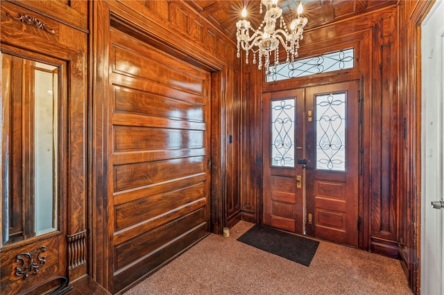 101 Cherry Ave, Houston, PA 15342 - carpeted entryway featuring wood walls and a notable chandelier