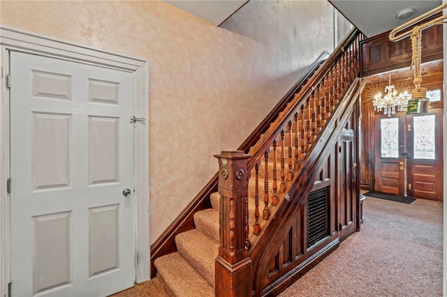 101 Cherry Ave, Houston, PA 15342 - stairs with a chandelier and carpet flooring