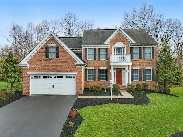 107 Stafford Ct, Ohio Twp, PA 15237 - colonial-style house with brick siding, a front lawn, driveway, and a balcony