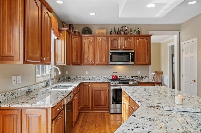 107 Stafford Ct, Ohio Twp, PA 15237 - kitchen with a sink, light wood-type flooring, recessed lighting, stainless steel appliances, and light stone counters
