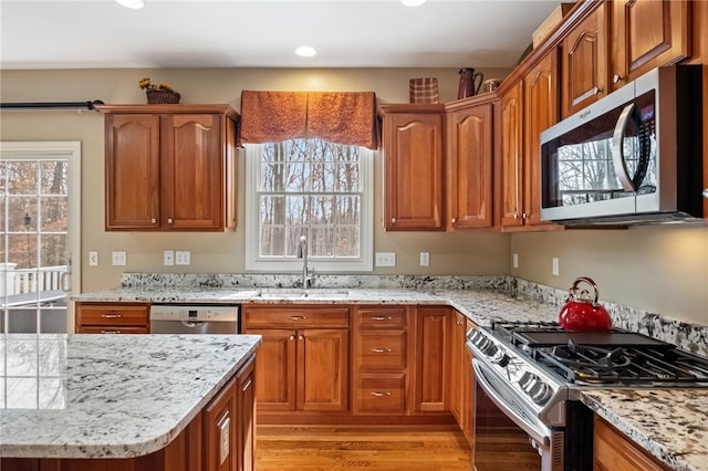 107 Stafford Ct, Ohio Twp, PA 15237 - kitchen with a sink, light stone countertops, light wood-type flooring, and stainless steel appliances