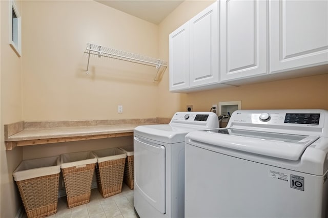 107 Stafford Ct, Ohio Twp, PA 15237 - laundry area featuring light tile patterned floors, separate washer and dryer, and cabinet space