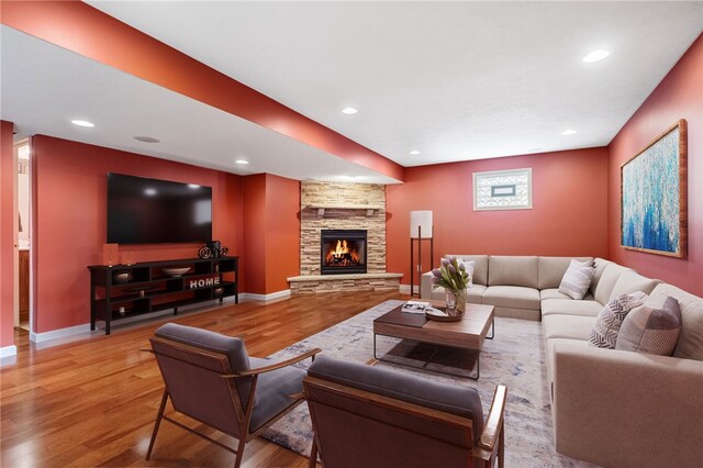 107 Stafford Ct, Ohio Twp, PA 15237 - living room featuring a stone fireplace, baseboards, recessed lighting, and wood finished floors
