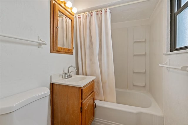 bathroom with toilet, shower / bath combo with shower curtain, and vanity