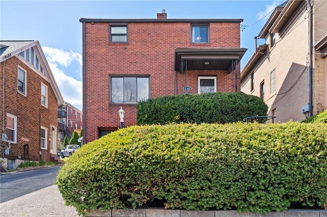 view of front of house featuring brick siding