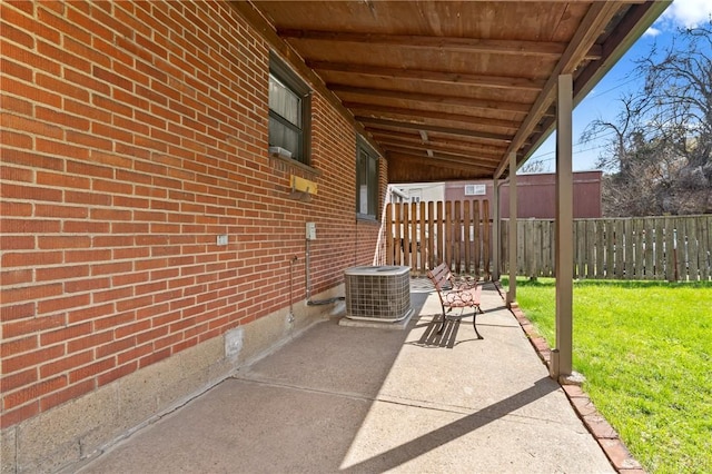 view of patio / terrace with central AC and fence
