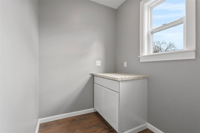 bathroom featuring baseboards and wood finished floors