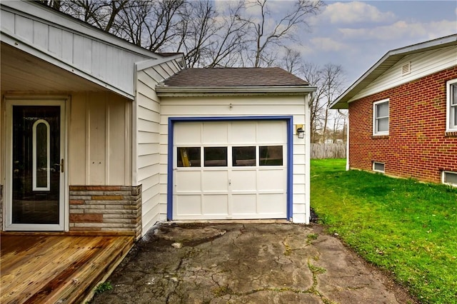 garage with aphalt driveway