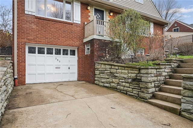 285 Park Entrance Dr, Mt Lebanon, PA 15228 - view of property exterior featuring concrete driveway, brick siding, and an attached garage