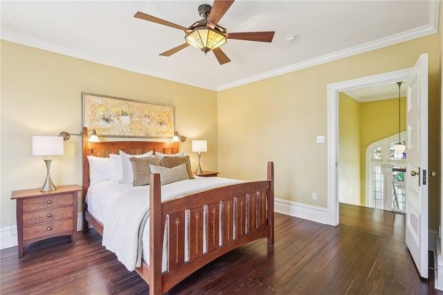 bedroom with baseboards, hardwood / wood-style floors, ornamental molding, and ceiling fan
