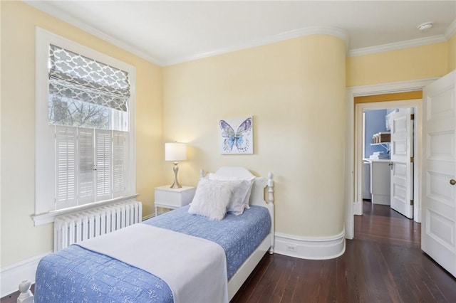 bedroom with radiator, wood finished floors, baseboards, and ornamental molding