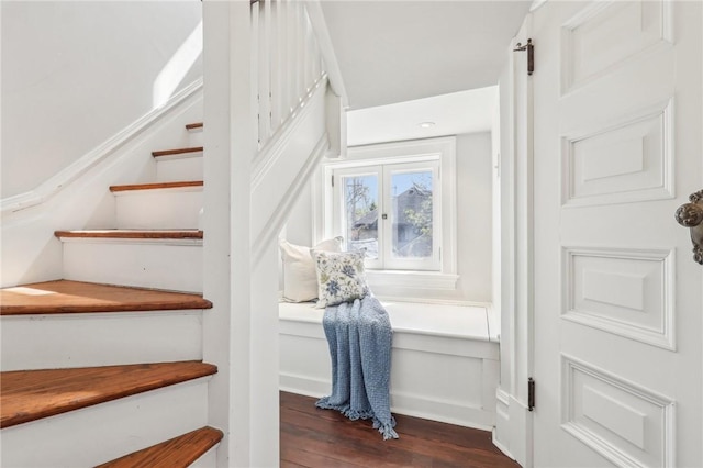 stairway with wood finished floors