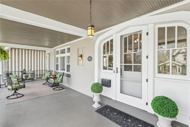 doorway to property with a porch