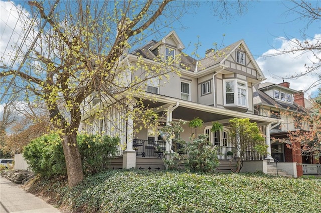 view of front of home with a porch and stucco siding
