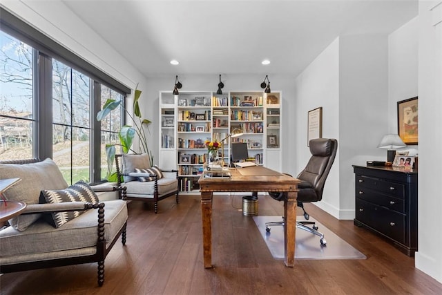 home office featuring recessed lighting, hardwood / wood-style flooring, and baseboards