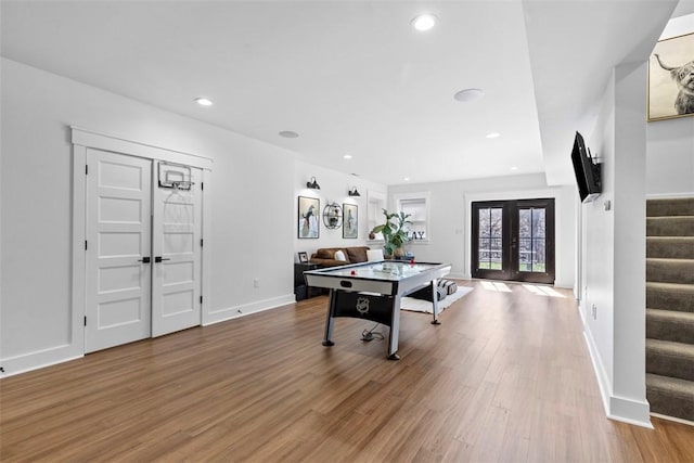 rec room featuring recessed lighting, french doors, baseboards, and wood finished floors