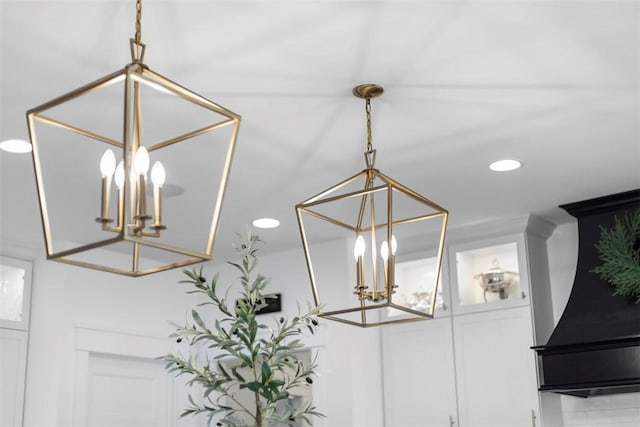 interior details with recessed lighting and an inviting chandelier