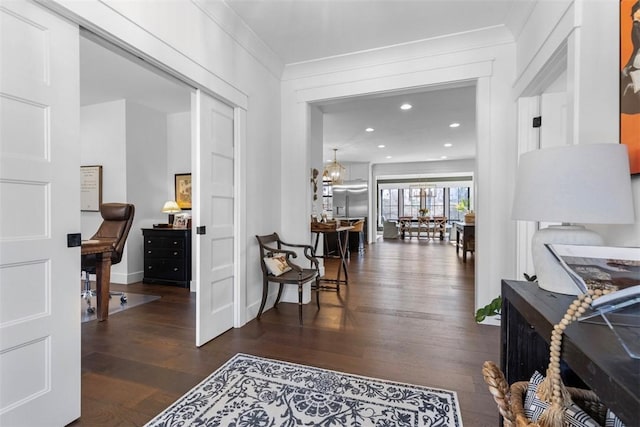 hall featuring recessed lighting and wood finished floors