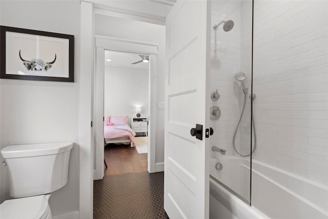 full bathroom with ensuite bath, toilet, ceiling fan, and shower / bath combination