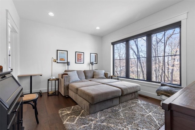 bedroom with dark wood-style flooring, baseboards, and recessed lighting