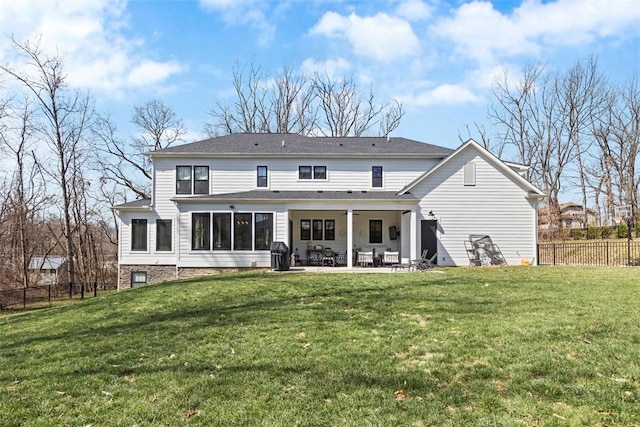 back of house featuring a patio, a yard, and fence