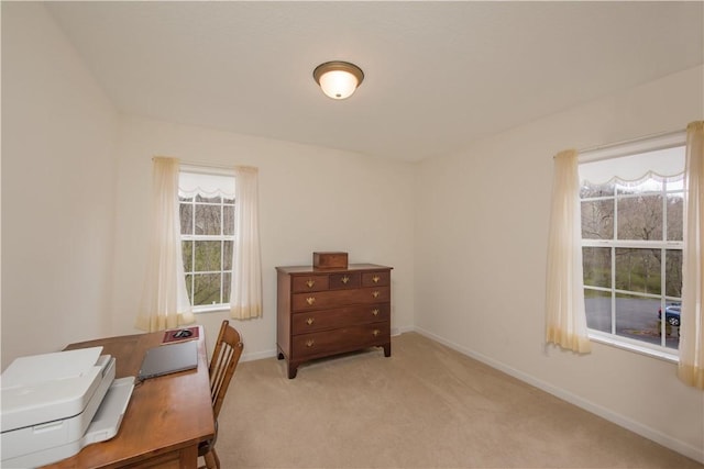 office with light colored carpet and baseboards