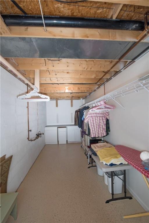 basement featuring concrete block wall
