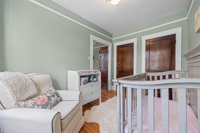 bedroom featuring wood finished floors