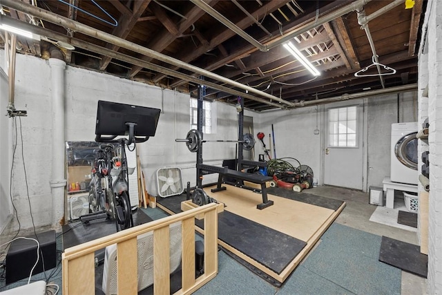 exercise area with washer / dryer
