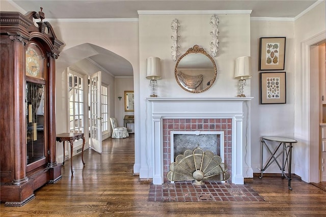 552 N Maple Ave, City Of Greensburg, PA 15601 - living room featuring arched walkways, a brick fireplace, crown molding, wood finished floors, and french doors
