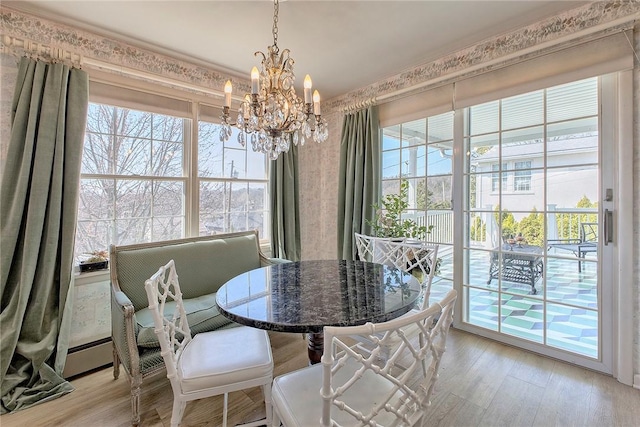 552 N Maple Ave, City Of Greensburg, PA 15601 - dining space with a chandelier and light wood-type flooring
