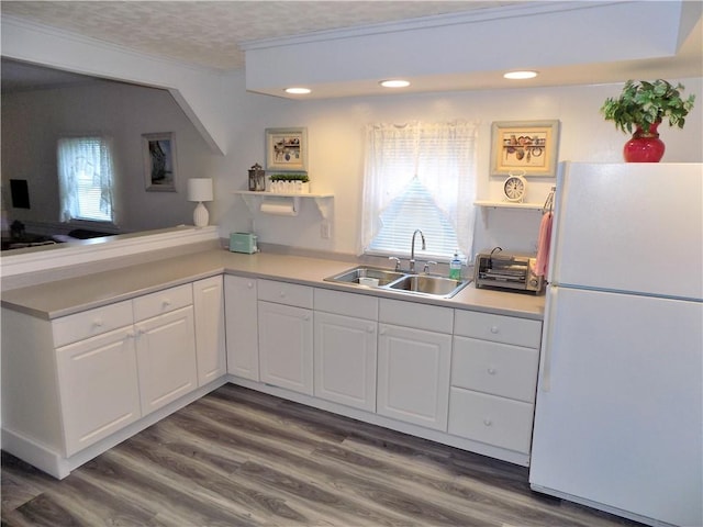 215 Maple St, Carmichaels/Cumblnd, PA 15320 - kitchen with white cabinetry, freestanding refrigerator, open shelves, dark wood-type flooring, and a sink