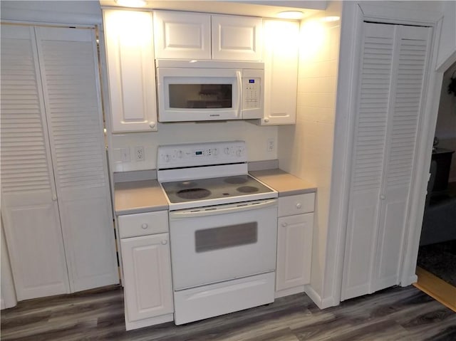 215 Maple St, Carmichaels/Cumblnd, PA 15320 - kitchen featuring dark wood finished floors, light countertops, white appliances, and white cabinets