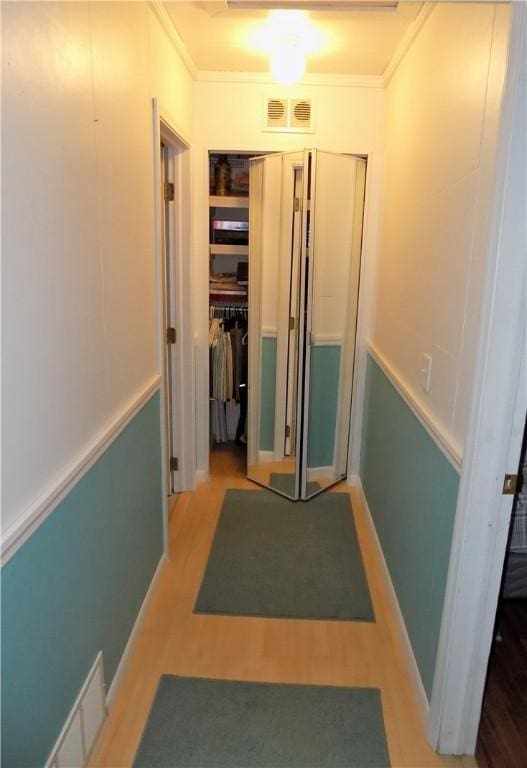 215 Maple St, Carmichaels/Cumblnd, PA 15320 - hall featuring ornamental molding, visible vents, and wood finished floors