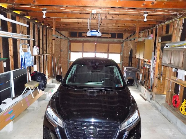 215 Maple St, Carmichaels/Cumblnd, PA 15320 - garage featuring a garage door opener