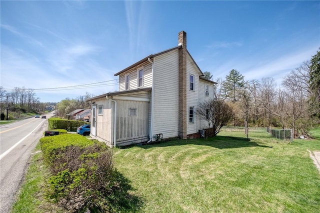 627 Rostraver Rd, Belle Vernon, PA 15012 - view of property exterior with a yard and a chimney