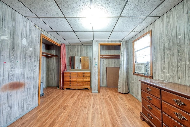 627 Rostraver Rd, Belle Vernon, PA 15012 - bedroom featuring wood walls, a paneled ceiling, cooling unit, and wood finished floors