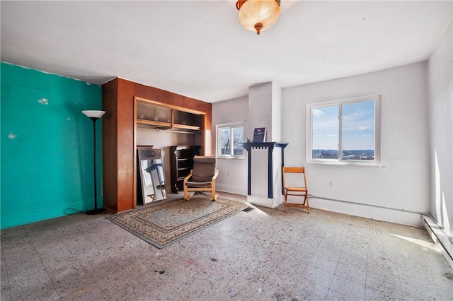 5179 Kincaid St, Garfield, PA 15224 - exercise area featuring tile patterned floors, a baseboard radiator, and baseboards