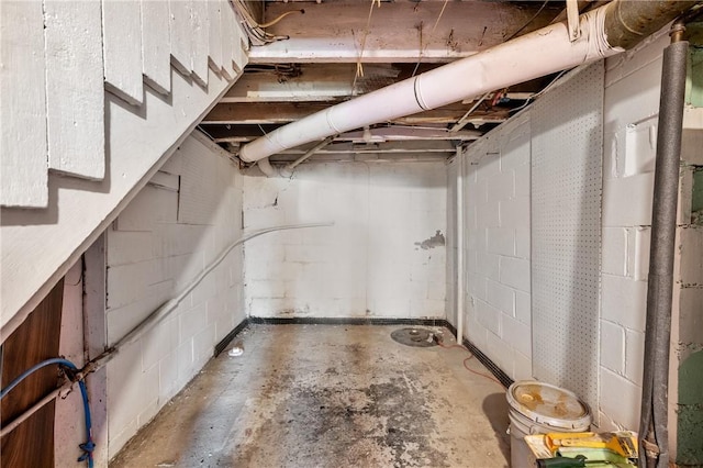 5179 Kincaid St, Garfield, PA 15224 - unfinished basement featuring concrete block wall and stairway