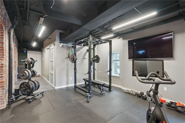 exercise room with baseboards