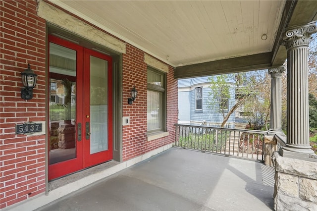 exterior space with french doors and covered porch