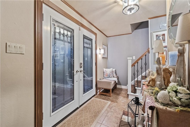 tiled foyer featuring french doors, ornamental molding, and stairs