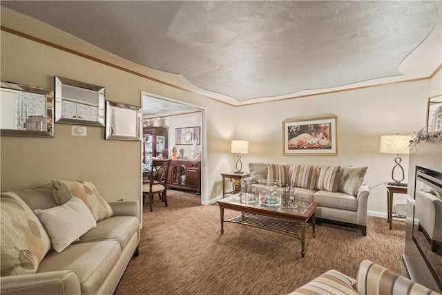 carpeted living room featuring ornamental molding and baseboards