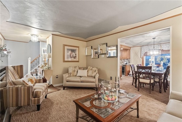 living room with baseboards, stairway, a notable chandelier, and light carpet