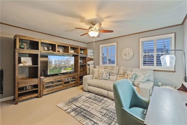 living room featuring crown molding, ceiling fan, and carpet flooring