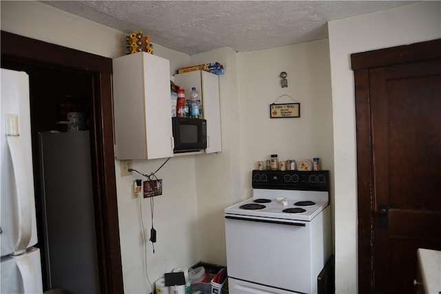 kitchen featuring black microwave, a textured ceiling, electric range, and refrigerator