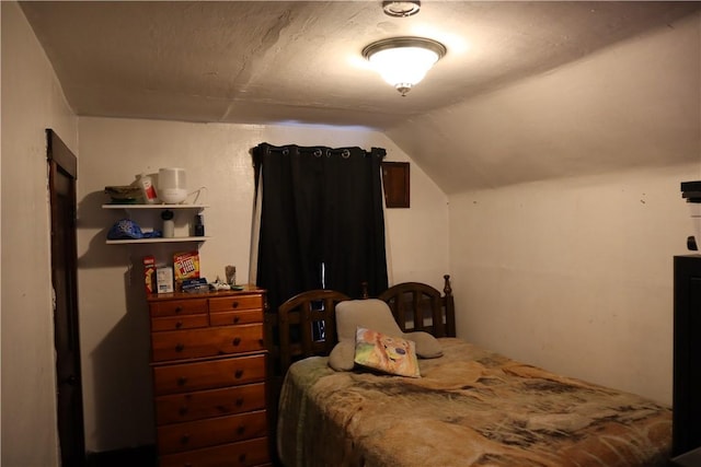bedroom with vaulted ceiling